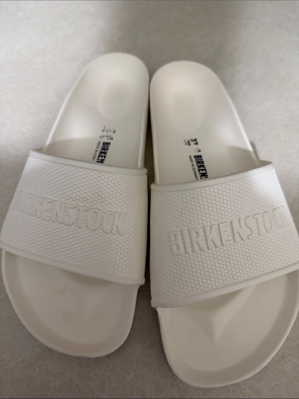 Birkenstock White Slide Sandals with Embossed Logo